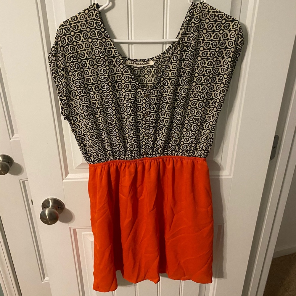 black, cream, and orange dress